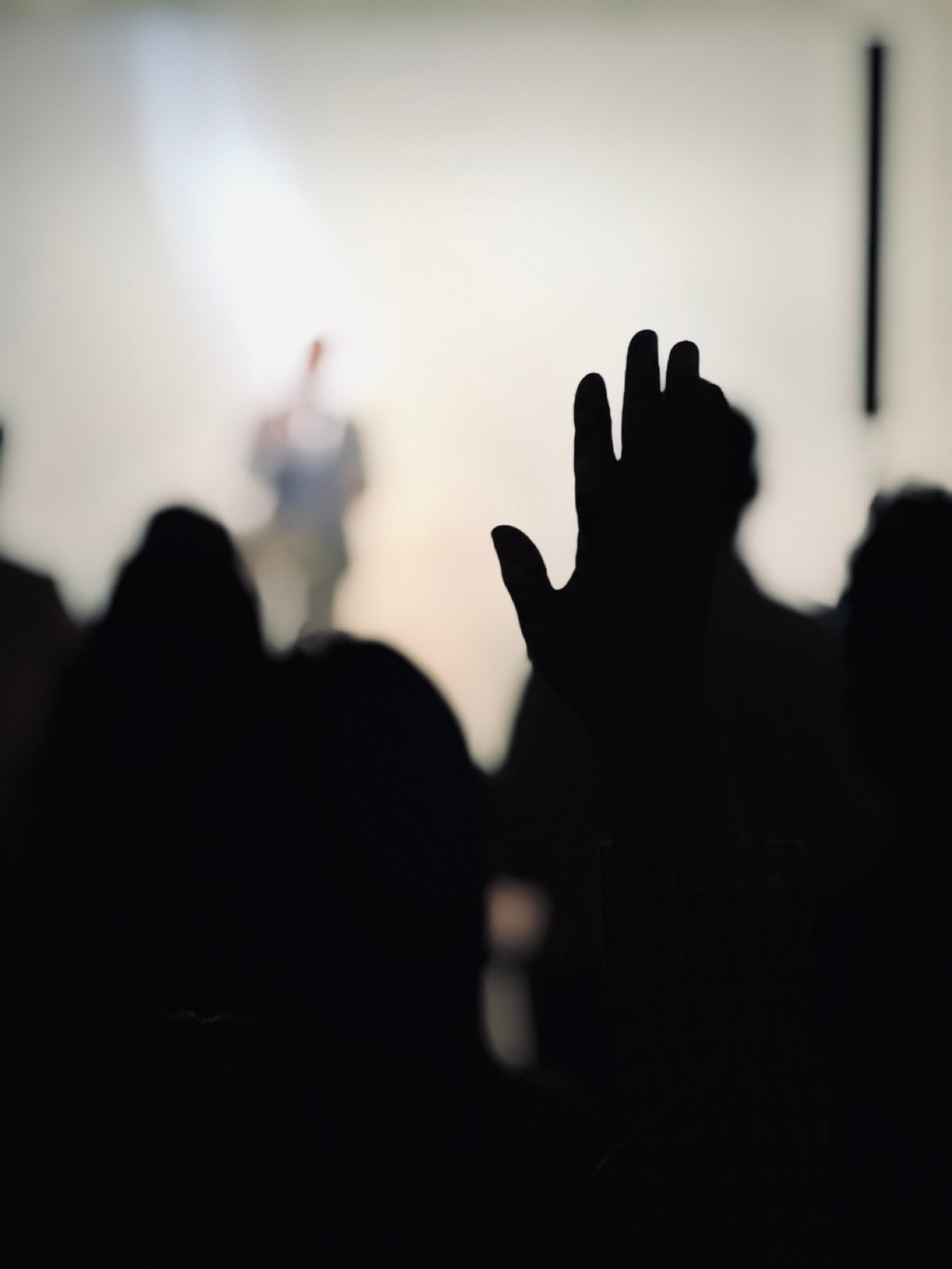 Hands raised in worship, August 2026